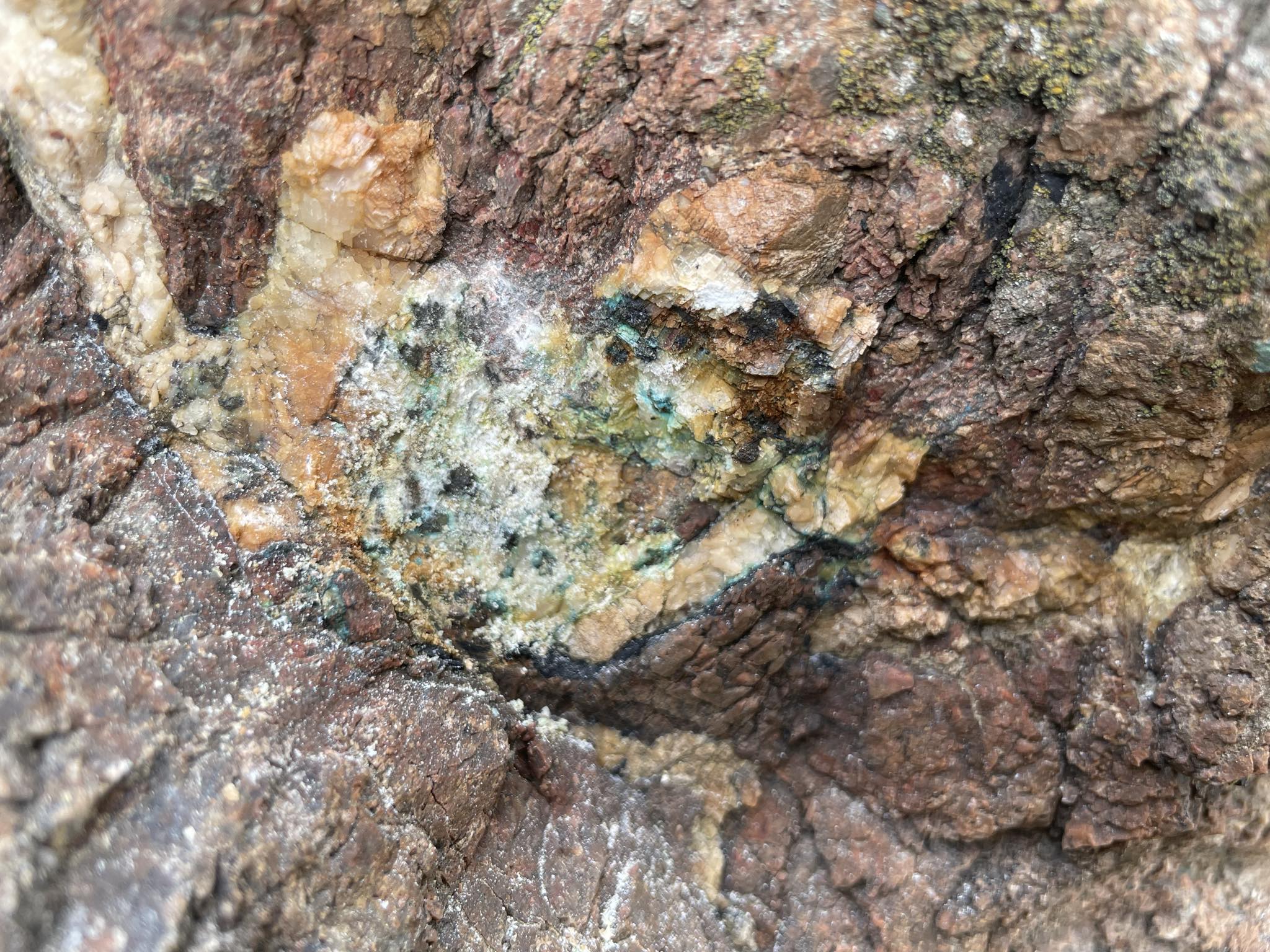 Unlocking the Secrets of Radioactive Minerals: The Role of Dykes, Granite, and Hydrothermal Activity