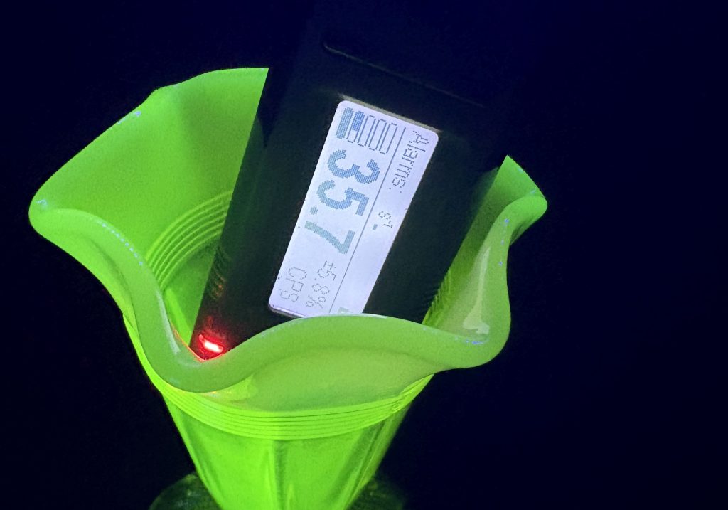 Geiger Counter measuring the radioactivity of a Pearline glass piece